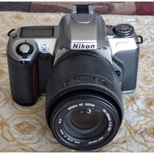 Nikon N65 35mm SLR film camera with a Sigma UC Zoom 70-210mm f/4-5.6 lens- READ!